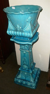 Lot 429 - A Bretby turquoise ground jardiniere on stand