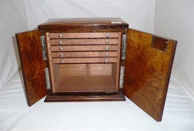 Lot 471 - An early 20th century walnut table top cigar humidor with twin plated handles and five pull out...