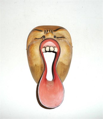 Lot 479 - A carved and painted wooden Oriental face mask