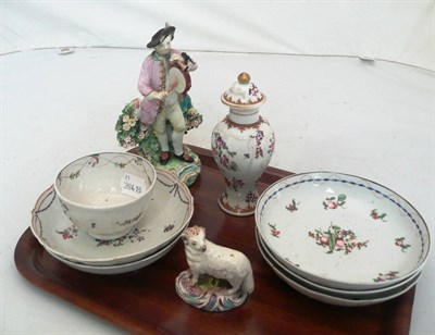 Lot 482 - A Derby figure (damaged), a tea bowl and various saucers, an early 19th century pottery sheep and a