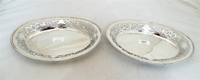 Lot 487 - A pair of pierced silver oval dishes, 29 oz