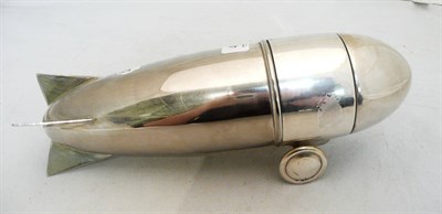 Lot 491 - An Art Deco style white metal cocktail shaker in the form of an airship