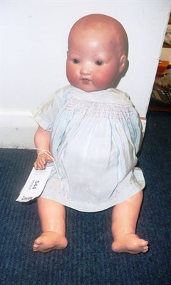 Lot 544 - Bisque socket head doll on composition bent limb body