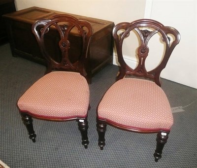 Lot 624 - A set of four Victorian mahogany dining chairs, another set with carved slats to the back, all...