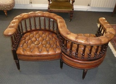 Lot 637 - Early 20th century mahogany leather button back conversation settee