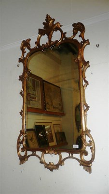 Lot 640 - A George II style gilt and gesso wall mirror