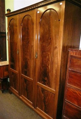 Lot 665 - Early 20th century mahogany triple wardrobe