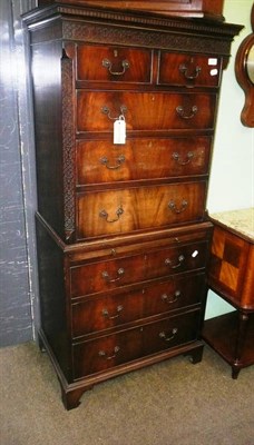 Lot 668 - Reproduction mahogany tall boy chest with blind fret carving