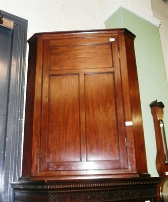 Lot 669 - Mahogany corner cupboard, with two shelves (and key)