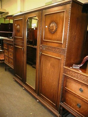 Lot 682 - A carved oak three piece bedroom suite