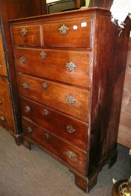 Lot 697 - George III oak five height chest