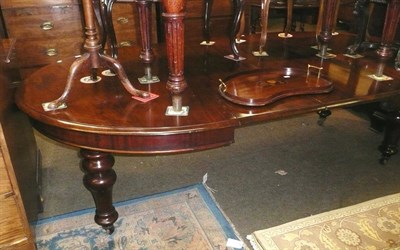 Lot 706 - A Victorian mahogany extending dining table with two leaves