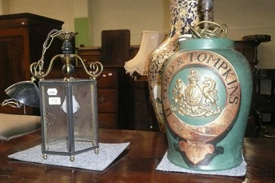 Lot 712 - A brass mounted modern lantern and a modern composition decorative table lamp with painted...