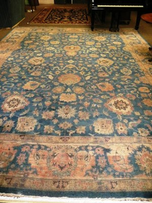 Lot 716 - Agra design carpet, India, the soft indigo field with cloud bands, palmettes and scrolling...