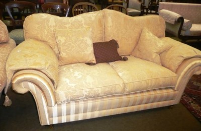 Lot 744 - A Wade sofa with serpentine back upholstered in yellow silk fabric