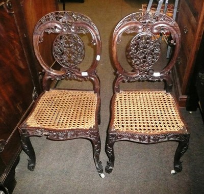 Lot 794 - A pair of Anglo/Indian dining chairs with caned seats