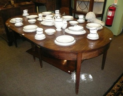 Lot 803 - A George III mahogany 'D' end dining table, with two leaves and a later leaf