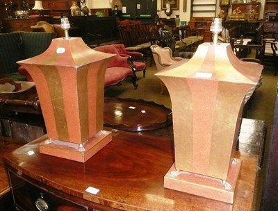 Lot 812 - A pair of toleware orange and gold striped table lamps