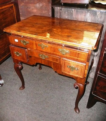 Lot 813 - An 18th century walnut lowboy