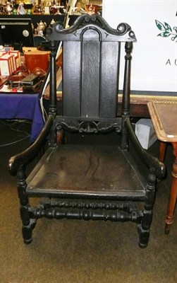 Lot 824 - 18th century carved oak open arm chair