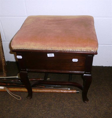 Lot 835 - An upholstered mahogany piano stool