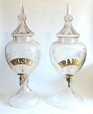 Lot 1079 - A Pair Of Reproduction Cut Glass Spirits Dispensers, each individually labelled in gilt...