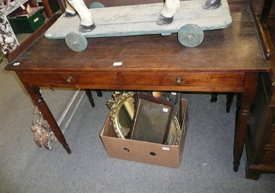 Lot 1125 - A Victorian oak two drawer writing table