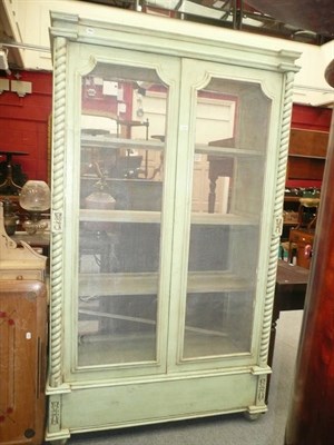 Lot 1149 - A green painted Continental style two door cupboard (a.f.)