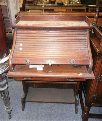 Lot 1164 - A small oak bureau with tambour front