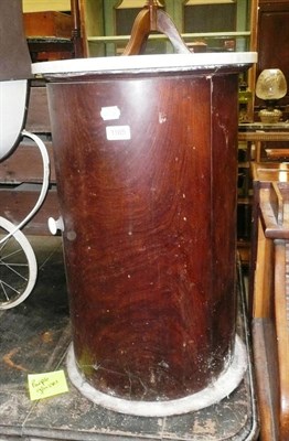 Lot 1165 - A mahogany cylinder bedside cabinet with marble top