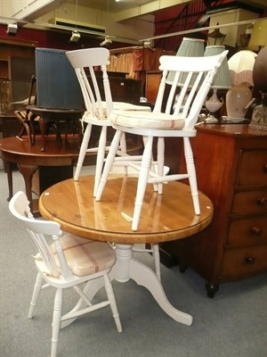 Lot 1205 - Pine pedestal kitchen table and four chairs