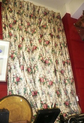 Lot 1282 - Two pairs of floral cotton chintz curtains (lined and interlined) with a triple pleat heading