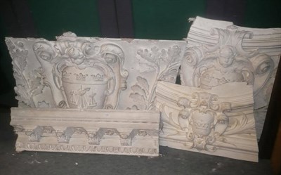 Lot 1302 - A large quantity of white painted plaster relief coving and wall mouldings depicting heraldic...