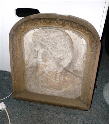 Lot 1308 - A carved stone portrait relief in an arched frame