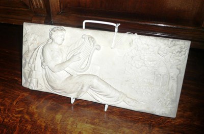 Lot 467A - White marble carved relief panel of a young lady playing a harp