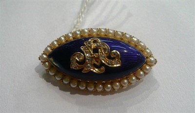 Lot 5 - A Victorian brooch of blue enamel within a seed pearl border, diamond set initials overlaid -...