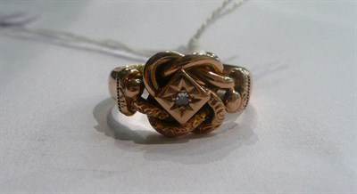 Lot 16 - A 9ct gold diamond set knot ring