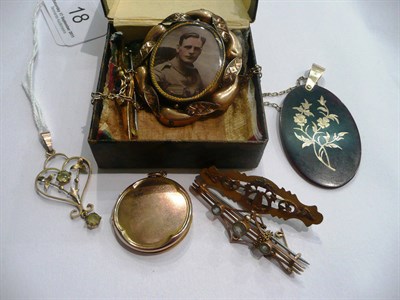 Lot 18 - A peridot pendant, several bar brooches and a locket
