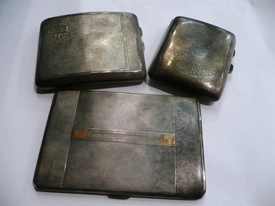 Lot 21 - Three silver cigarette cases, 14oz approx