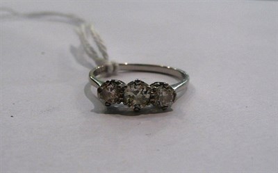 Lot 45 - A diamond three stone ring, stamped 'PLAT'