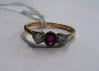 Lot 58 - A ruby and diamond three stone ring