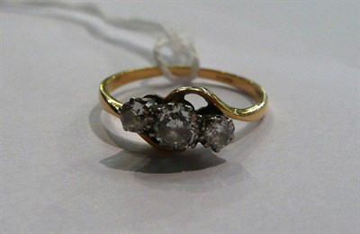 Lot 59 - A diamond three stone twist ring