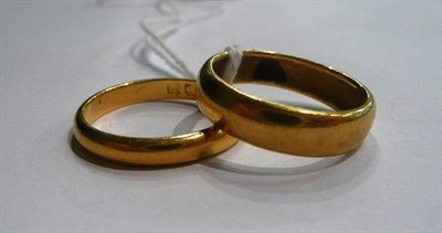 Lot 61 - Two 22ct gold band rings