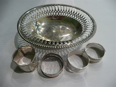 Lot 66 - A silver basket, three silver napkin rings and another, 6oz approx