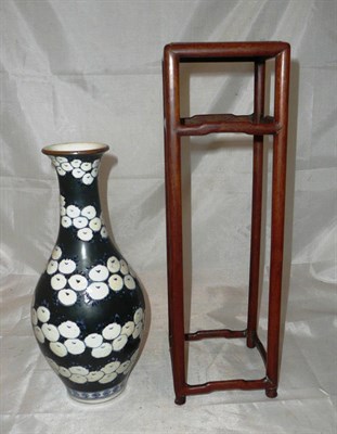 Lot 85 - 19th century rosewood vase stand and pomegranate pattern Chinese vase
