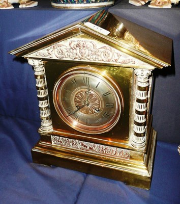 Lot 111 - A brass striking mantel clock