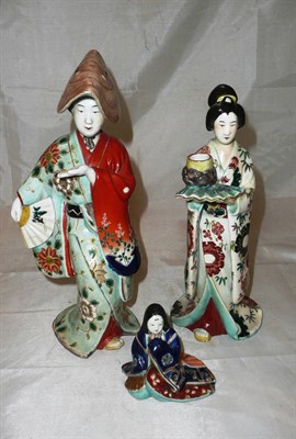 Lot 139 - Pair of Japanese figures and a smaller example