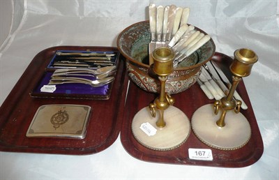 Lot 167 - Six silver teaspoons, a pair of candlesticks, mother-of-pearl handled flatware, white metal...
