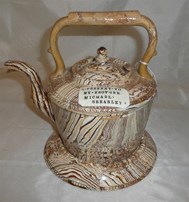 Lot 179 - An unusual marbled slip Measham Pottery kettle on stand, circa 1900, of "copper kettle" form...