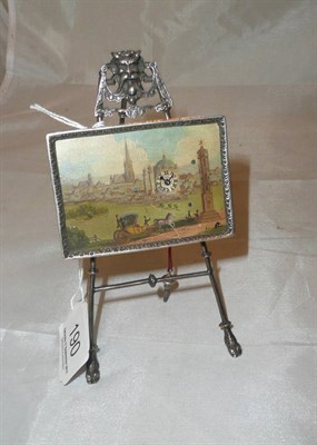 Lot 190 - A miniature silver strut clock modelled as an oil painting on an easel